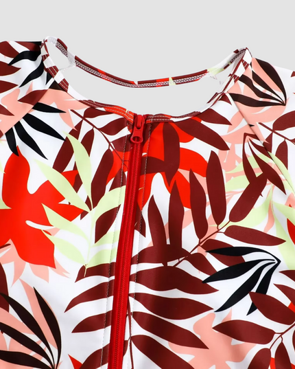 Neckline detail of tropical leaf print one piece with center front zipper