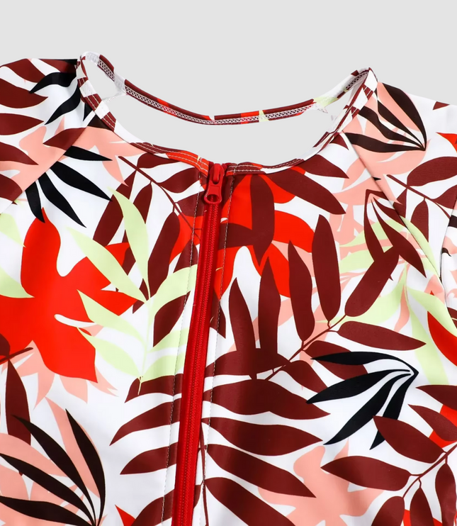 Neckline detail of tropical leaf print one piece with center front zipper