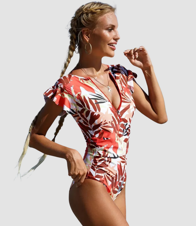 Red tropical leaf print one piece swimsuit with ruffled cap sleeves, front view