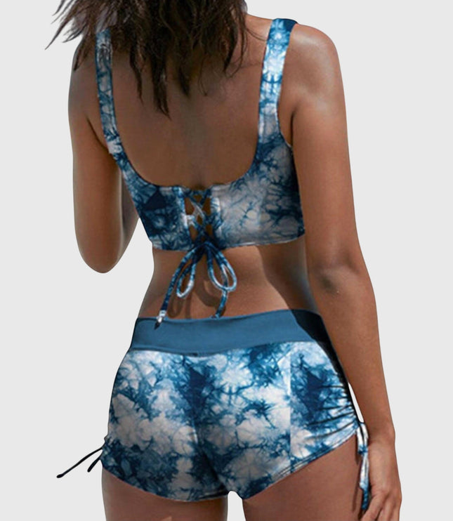 Back view of blue tie-dye bikini with lace-up back closure and side-tie shorts