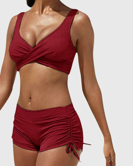 Burgundy two-piece bikini with wrap-front top and ruched side-tie shorts