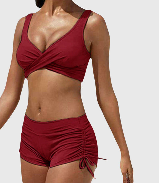 Burgundy two-piece bikini with wrap-front top and ruched side-tie shorts