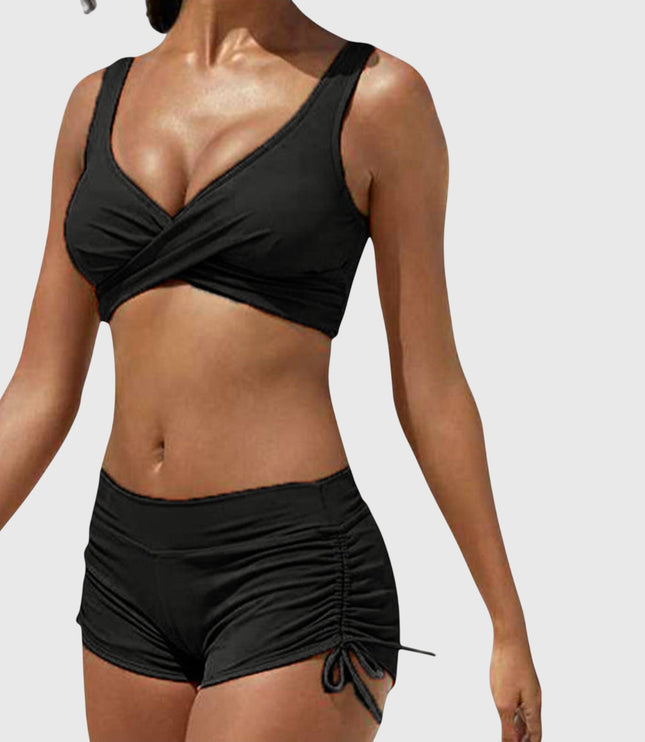 Black two-piece bikini with wrap-front top and ruched side-tie shorts