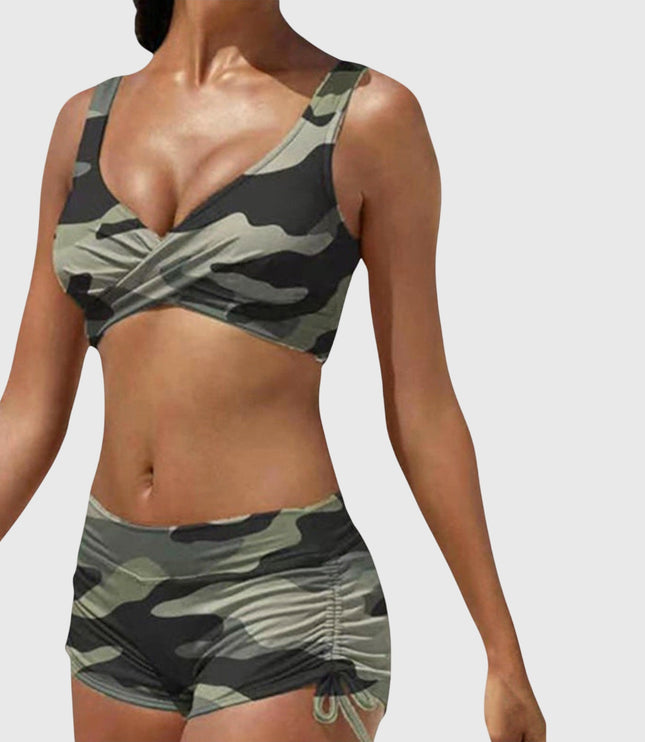 Camo two-piece bikini swimsuit with olive and black pattern, wrap-front top and ruched shorts