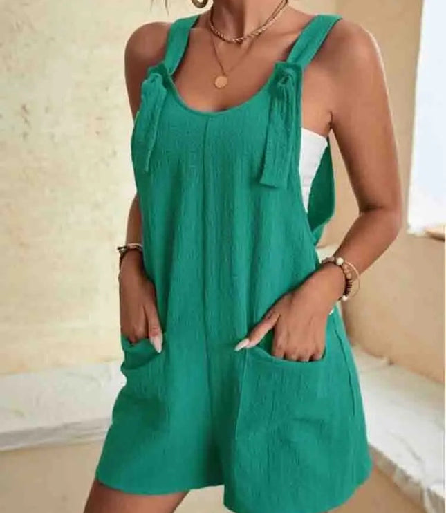 Teal linen tie strap romper with functional pockets and adjustable straps