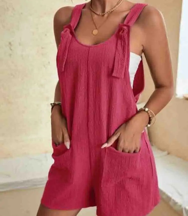 Magenta pink linen romper with tie shoulder straps and patch pockets