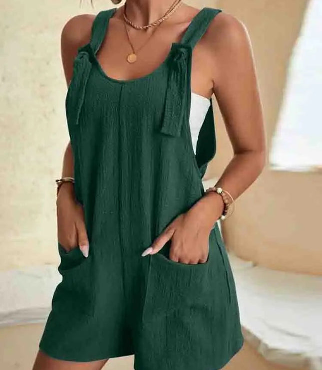 Deep forest green linen romper with knotted tie straps and side pockets