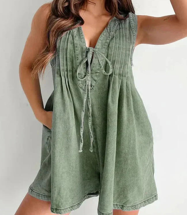 Olive green women's mini denim romper with V-neck tie front, pleated top, and relaxed shorts fit