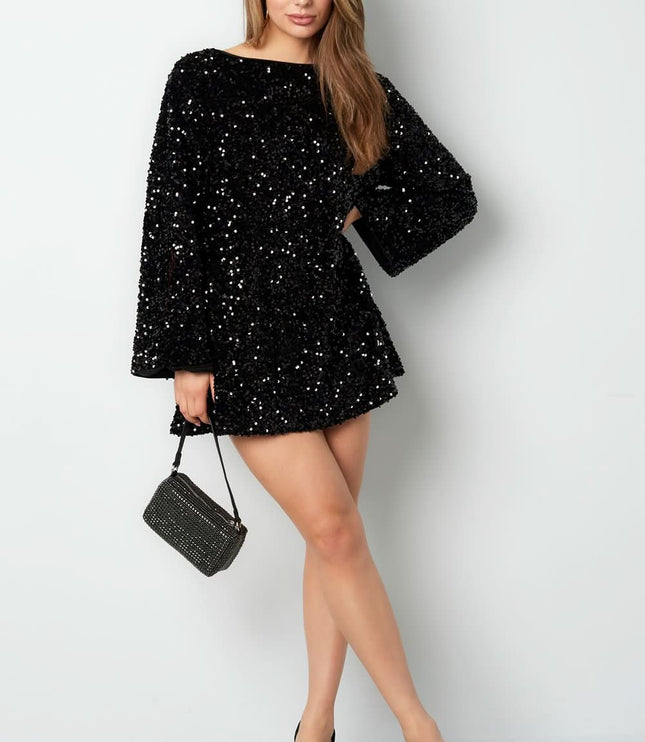 Black sequin mini dress with long bell sleeves and a fitted cocktail silhouette, styled with a small handbag
