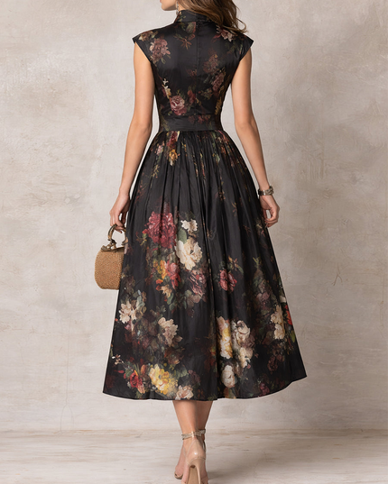 Back view of black floral midi dress with cap sleeves and fitted waist, elegant cocktail dress