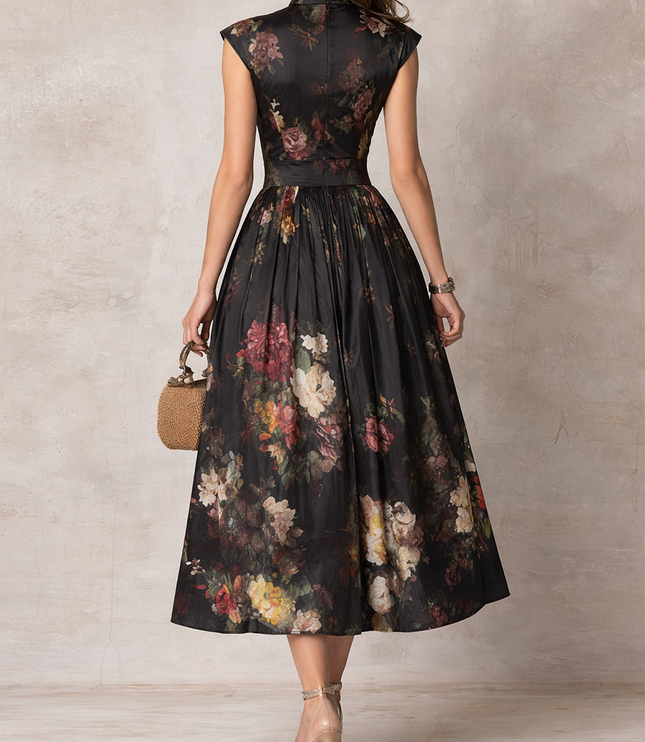Back view of black floral midi dress with cap sleeves and fitted waist, elegant cocktail dress