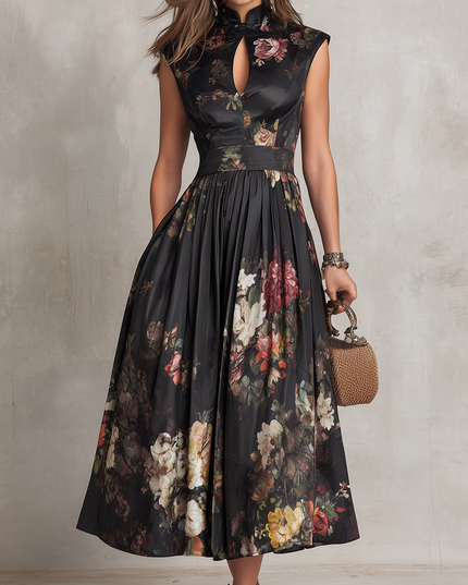 Front view of black floral midi dress with sleeveless high neckline and flowing midi skirt