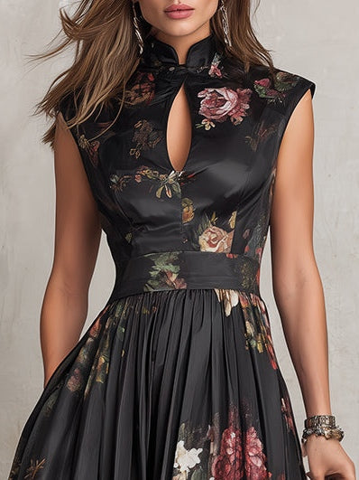 Close-up of black floral cocktail dress showing keyhole neckline, fitted bodice, and waist detail