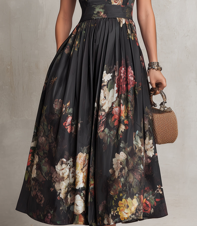 Close-up of floral midi dress skirt with black sheer overlay and colorful flower print