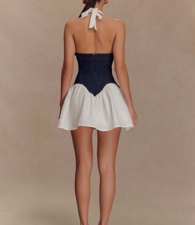 Back view of women’s halter mini corset dress with tie neck and zipper, white skirt