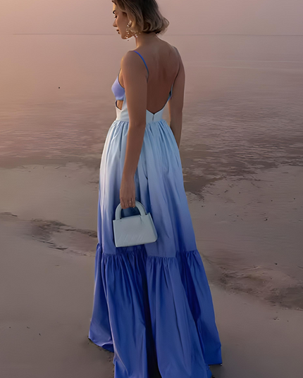 Back view of blue ombre maxi dress with open back and flowing tiered hem