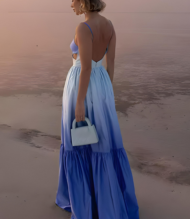 Back view of blue ombre maxi dress with open back and flowing tiered hem
