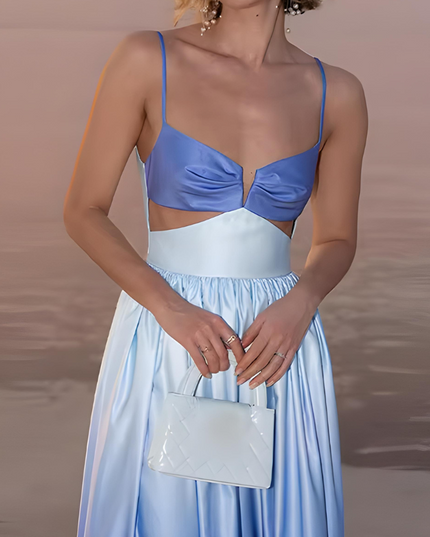 Close-up of sweetheart neckline and cutout waist on blue ombre cocktail dress