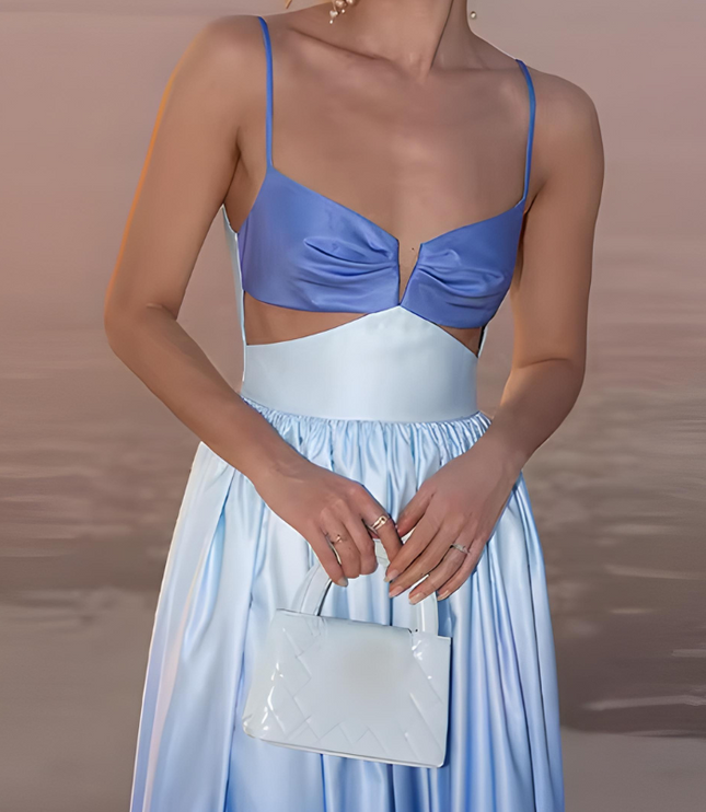 Close-up of sweetheart neckline and cutout waist on blue ombre cocktail dress