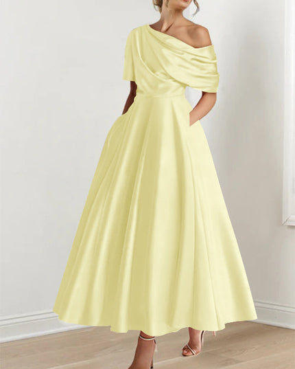 Soft yellow one-shoulder maxi dress with draped half-sleeve and A-line silhouette