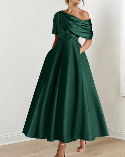 Forest green off-shoulder maxi dress with draped half-sleeve and flowing skirt