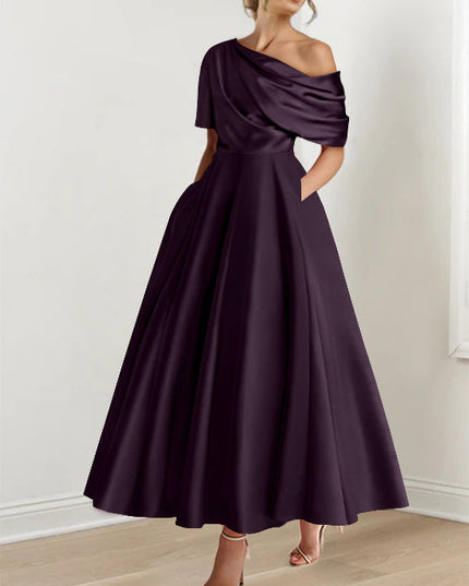 Deep plum one-shoulder maxi dress with draped half-sleeve and flowing skirt