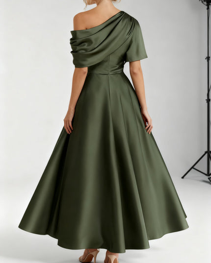 Back view of olive draped one-shoulder maxi dress with flowing skirt