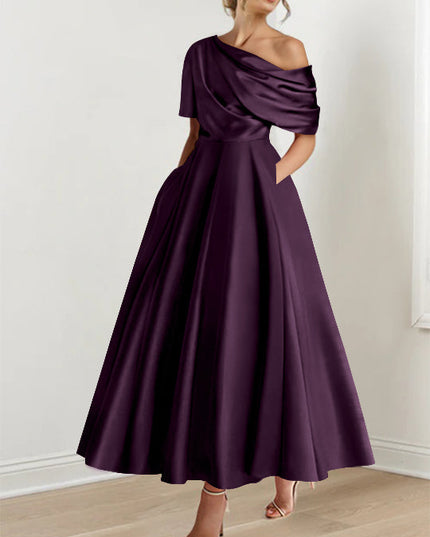 Deep plum one-shoulder maxi dress with draped half-sleeve and full skirt