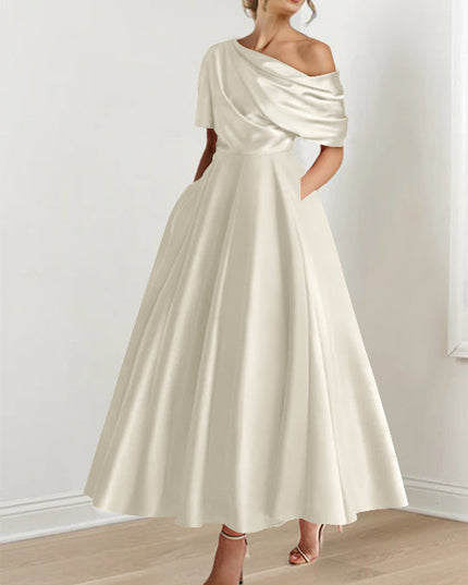 Cream one-shoulder maxi dress with draped half-sleeve and full skirt