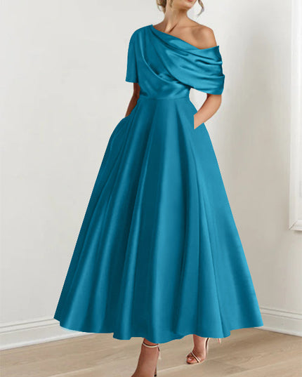 Teal one-shoulder maxi dress with draped half-sleeve and full skirt