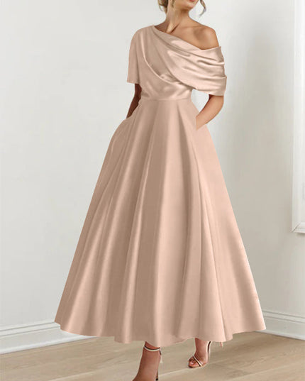 Champagne beige off-shoulder maxi dress with soft draping