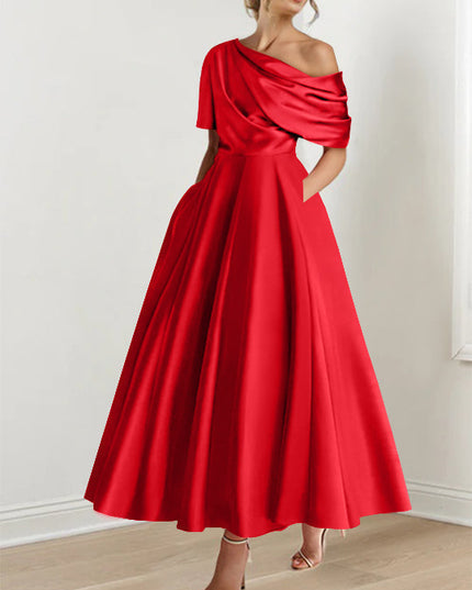 Bright red one-shoulder maxi dress with elegant draped detail