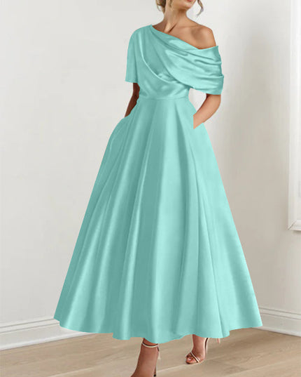 Mint green one-shoulder maxi dress with half-sleeve and pleated skirt detail