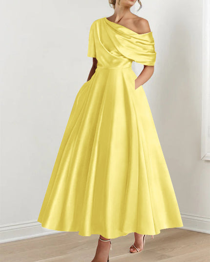 Bright yellow one-shoulder maxi dress with half-sleeve and voluminous skirt