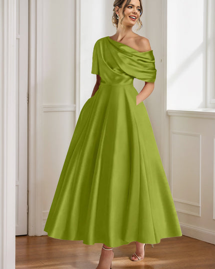 Chartreuse green one-shoulder maxi dress with half sleeves and flowing skirt