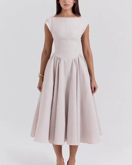 Back view of blush midi cocktail dress with open back and full skirt