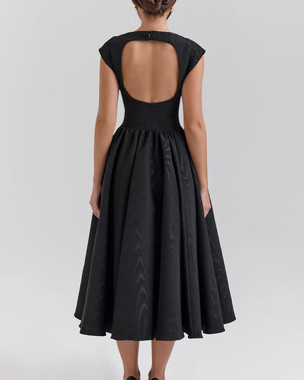 Front view of black open back midi dress with boat neckline and full skirt