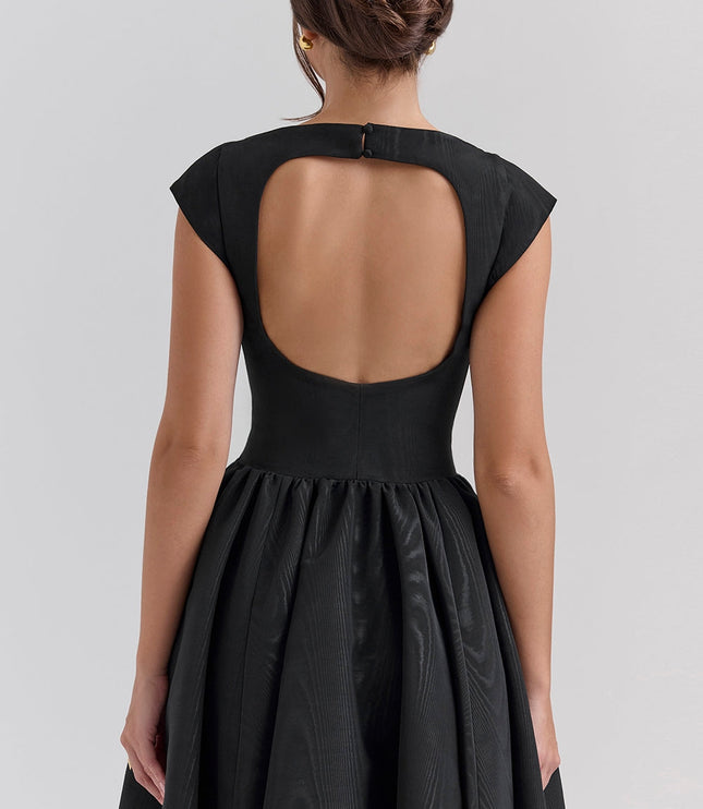 Back view of black cocktail dress with large open back and fitted bodice