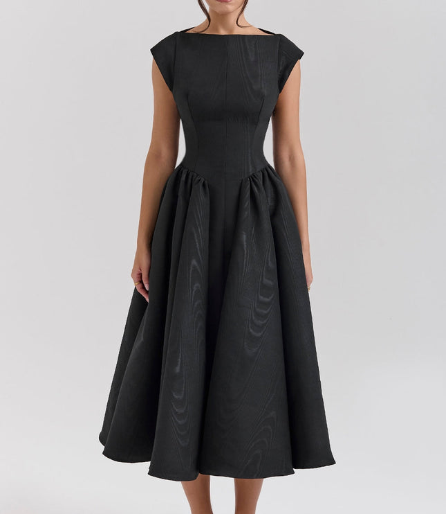 Black midi cocktail dress with open back, cap sleeves, and full flared skirt