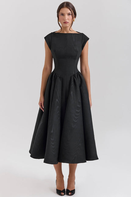 Black midi cocktail dress with open back, cap sleeves, and full flared skirt