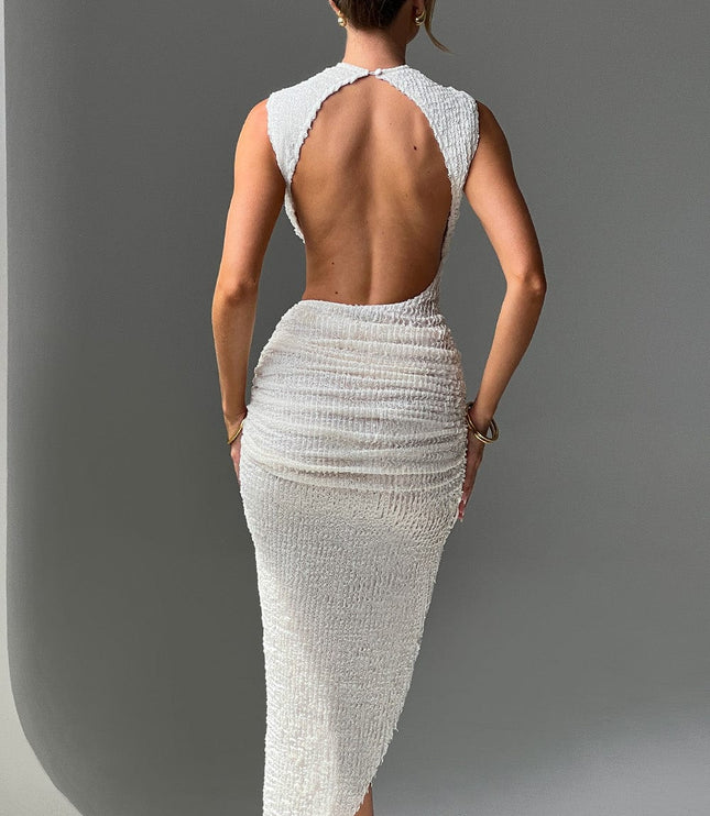 Back view of white textured one piece swimsuit style dress with open back cutout