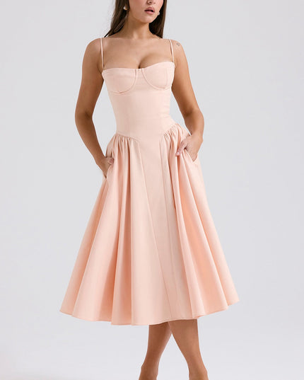 Blush pink cocktail midi dress with adjustable straps, structured cups, and side pockets