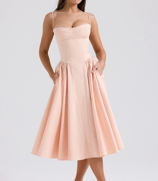 Blush pink cocktail midi dress with adjustable straps, structured cups, and side pockets