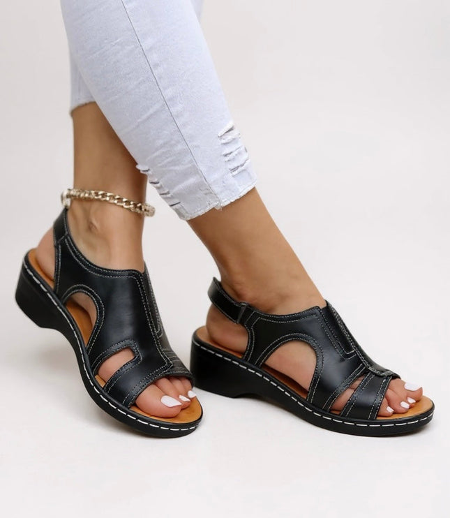 Black peep toe wedge sandals with contrasting stitching and adjustable slingback strap