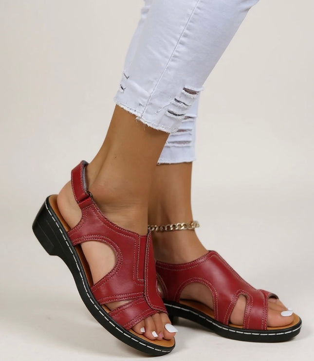 Red leather peep toe wedge sandals with adjustable strap and cushioned sole