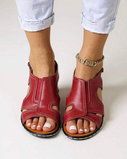 Red leather slingback wedge sandals with cutout details and adjustable ankle closure