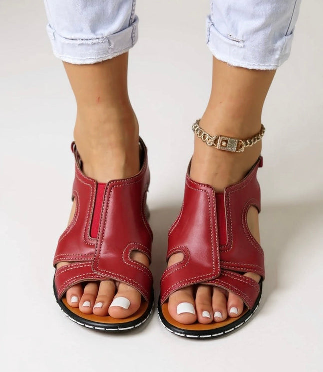 Red leather slingback wedge sandals with cutout details and adjustable ankle closure
