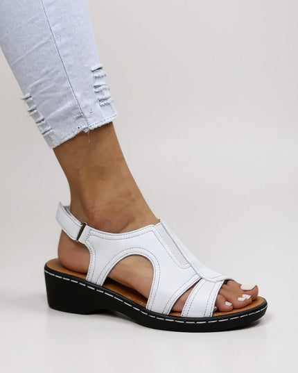 White comfort wedge sandals with cutout design and adjustable slingback strap