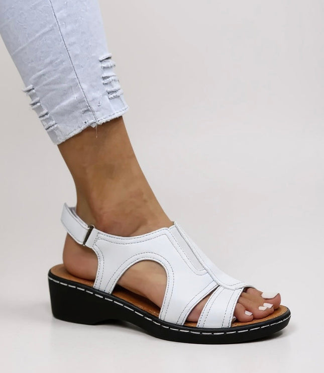 White comfort wedge sandals with cutout design and adjustable slingback strap
