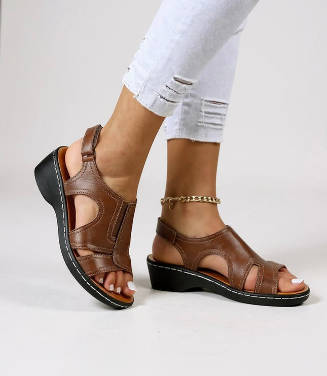 Brown leather peep toe wedge sandals with adjustable strap and black sole